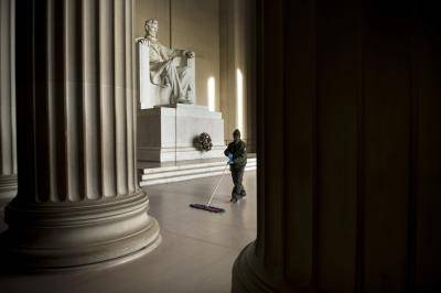 A US National Park employee cleans the floor of the Lincoln Memorial after a wreath-laying ceremony to honour Abraham Lincoln’s 207th birthday on 12 February 2016 in Washington, DC. Photo: Getty Images.
