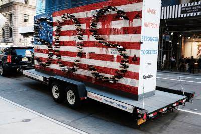 Artwork representing a divided nation by American artist David Datuna circles around the Trump Tower in New York City. Photo by Spencer Platt/Getty Images