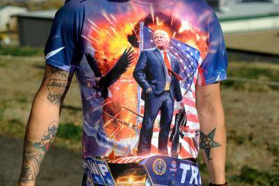 A Donald Trump supporter wears a colourful shirt showing his support. Photo by JASON CONNOLLY/AFP/Getty Images.
