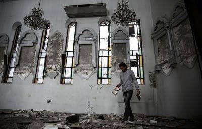 Amidst the ruins of St Elias church in the rebel-held area of Harasta on 13 November 2016. Photo by Getty Images.