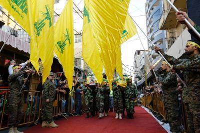 Members and supporters of Hezbollah in Beirut carry the coffins of fighters killed in combat alongside Syrian government forces in Syria. Photo by Getty Images.

