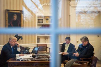 Trump with Stephen Bannon and Michael Flynn in the Oval Office. Photo: Getty Images.