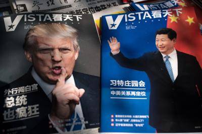 On the newsstand in Beijing, magazines feature Donald Trump Xi Jinping. Photo: Getty Images.