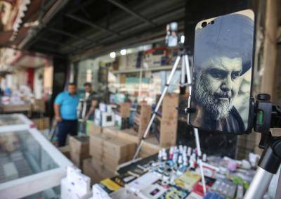 A Muqtada al-Sadr mobile phone cover for sale in a Baghdad market. Photo: Getty Images.