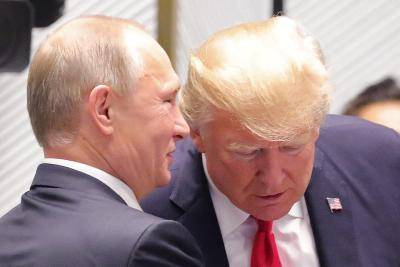 Vladimir Putin and Donald Trump meet during the APEC summit in Vietnam on 11 November 2017. Photo via Getty Images.