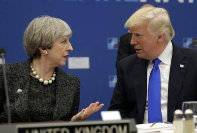 Donald Trump and Theresa May speak at the 2017 NATO summit in Brussels. Photo: Getty Images.