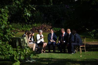 Theresa May speaks with other leaders at the Western Balkans summit in London. Photo: Getty Images.