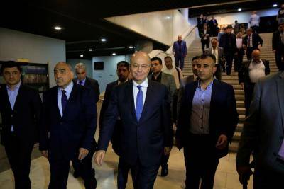 Barham Salih leaves the Iraqi parliament building with Adil Abdal-Mehdi on 2 October. Photo: Getty Images.
