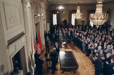 Mikhail Gorbachev and Ronald Reagan shake hands after signing the INF Treaty in 1987. Photo: Getty Images.