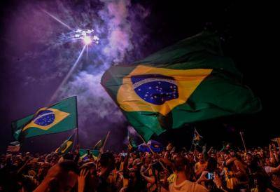 Supporters of Jair Bolsonaro celebrate his election win in Rio de Janeiro. Photo: Getty Images.