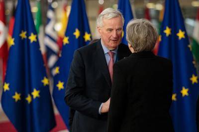 Michel Barnier greets Theresa May at the European Council summit in March. Photo: Getty Images.