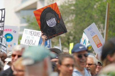 Photo by The Climate Reality Project, 'People's Climate March Protest', via Unsplash, 2017.