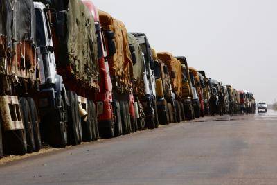 A convoy of trucks carrying humanitarian assistance provided by the World Food Program (WFP) to Southern Sudanese refugees. Photo by ASHRAF SHAZLY/AFP/Getty Images.