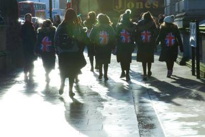 People with Union Flag backpacks in Whitehall on 19 December. Photo: Getty Images.