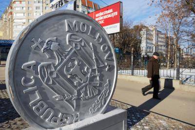 A man walks to the polls on election day, 24 February, in Chisinau. Photo: Getty Images.