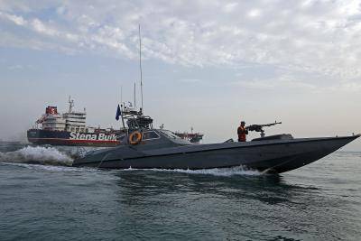 Iranian Revolutionary Guards patrol around the British-flagged tanker Stena Impero, anchored off the Iranian port city of Bandar Abbas. Photo by HASAN SHIRVANI/AFP/Getty Images.
