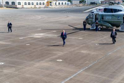 Donald Trump walks from Marine One to Air Force One at Ocala International Airport on 3 October. Photo: Getty Images.