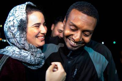 Moroccan journalist Hajar Raissouni is greeted by her boyfriend Rifaat Al Amine upon leaving prison after being granted a royal pardon (Photo by FADEL SENNA/AFP via Getty Images).