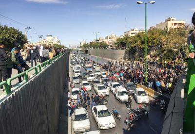 Iranian protesters block a road during a demonstration against an increase in gasoline prices in Isfahan on 16 November. Photo: Getty Images.