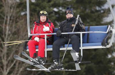 Russian president Vladimir Putin and Belarus president Aliaksandr Lukashenka skiing in the Black Sea resort of Sochi, Russia. Photo by SERGEI CHIRIKOV/AFP via Getty Images.