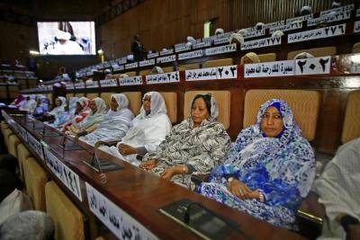 Sudanese MPs attend a parliamentary seesion in Khartoum, as lawmakers discuss the measure imposed by the president to quell anti-government protests. Photo by ASHRAF SHAZLY/AFP/Getty Images.