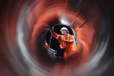 A worker at the construction site of a section of the Nord Stream 2 natural gas pipeline near Kingisepp, Leningrad Region. Photo by Alexander Demianchuk\TASS via Getty Images.