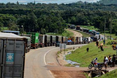 Truck drivers wait to be tested for COVID-19 on the road to enter Uganda in Malaba, a city containing the border with Kenya. Photo by BRIAN ONGORO/AFP via Getty Images.