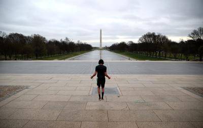 Exercising in front of a deserted Lincoln Memorial in Washington, DC. Photo by Win McNamee/Getty Images.