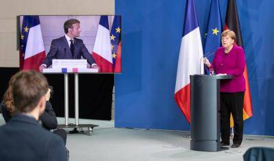 German chancellor Angela Merkel and French president Emmanuel Macron (via video) announce a joint EU recovery initiative to tackle the coronavirus crisis. Photo by Andreas Gora - Pool/Getty Image.
