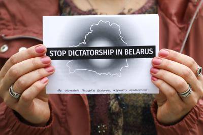 People protest at a rally of solidarity with political prisoners in Belarus. Photo by Beata Zawrzel/NurPhoto via Getty Images.