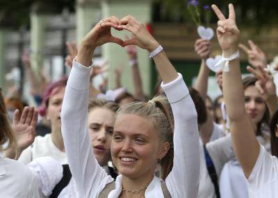 Women take part in an event in support of detained and injured participants in mass protests against the results of the 2020 Belarusian presidential election. Photo by Natalia Fedosenko\TASS via Getty Images.