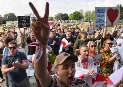 A mass rally in Grodno, Belarus where factory workers went on strike in protest against the election results and actions of law enforcement officers. Photo by Viktor Drachev\TASS via Getty Images.