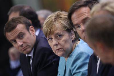 Angela Merkel, Emmanuel Macron and other EU leaders speaking to the media. Photo by Sean Gallup/Getty Images.