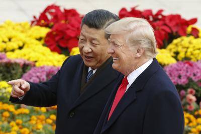 Chinese president Xi Jinping and US president Donald Trump in Beijing, China. Photo by Thomas Peter-Pool/Getty Images.
