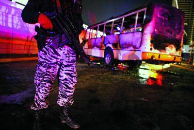 A state policeman stands