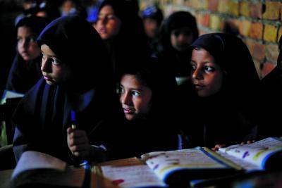 Children attend a class in a school in Qutbal, Pakistan.</body></html>
