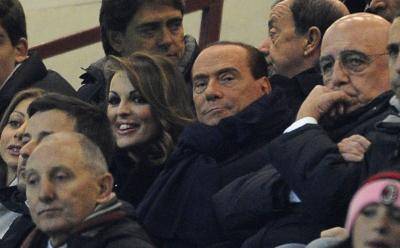 Silvio Berlusconi watches AC Milan play in a UEFA Champions league match. He sold the club in early 2017