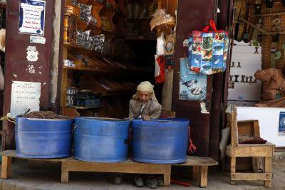 A Yemeni green tea seller sits inside his shop as he waits for customers at a market in Sana'a, Yemen.</body></html>